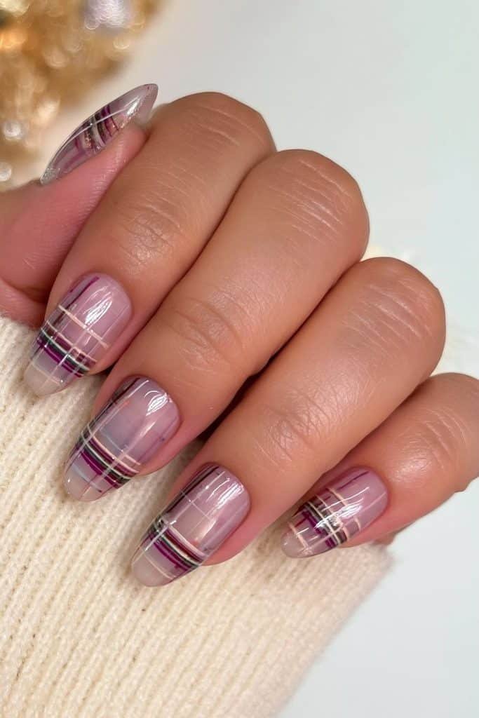 Translucent plaid jelly nails with burgundy, cherry red, cream, and forest green lines
