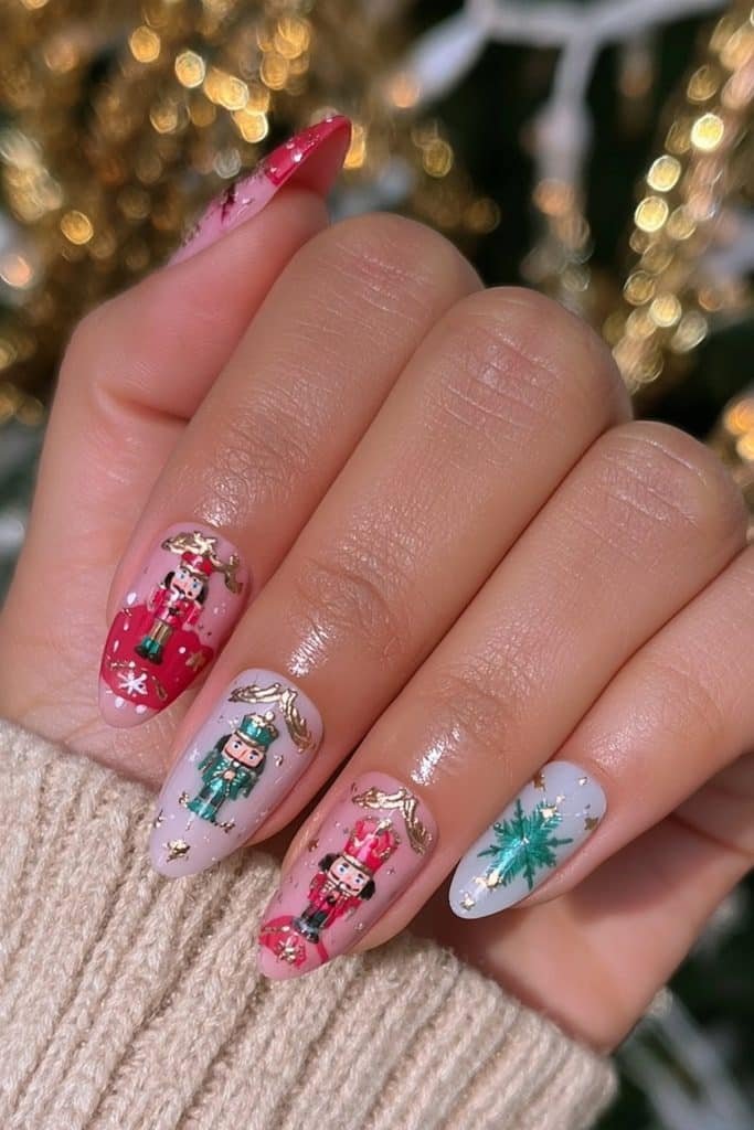 Almond press-on nutcracker nails in ruby red, emerald green, milky white, and metallic gold