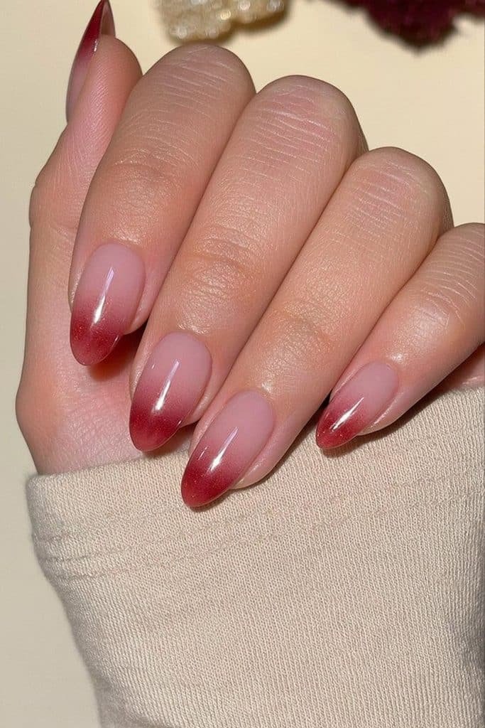 Sheer merlot jelly nails with translucent burgundy-red color and glossy wine-toned depth
