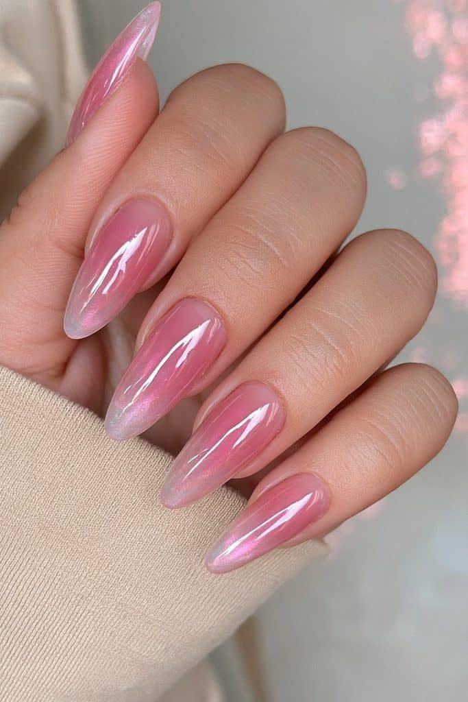 Sheer pink jelly nails with translucent blush tones and glossy glass-like finish