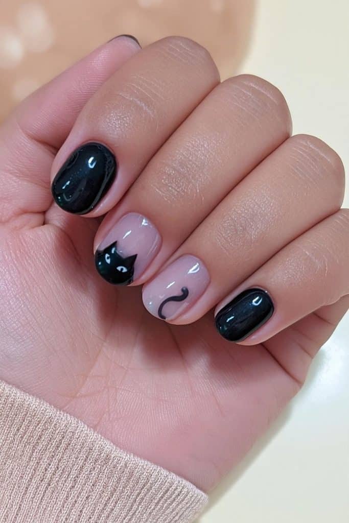Short black cat nails with tiny cat faces and curved tails on a milky nude base