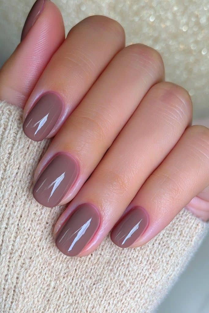 Short mocha mousse nails with soft creamy brown tones and a simple glossy finish