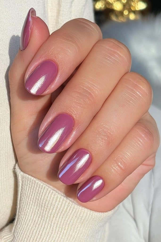 Short round sugar plum nails in creamy muted berry-mauve with glossy shine