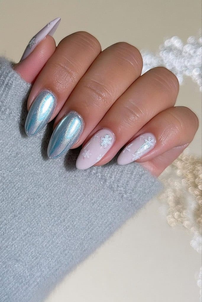 Silver chrome ski nails paired with snowy white polish and delicate snowflake details