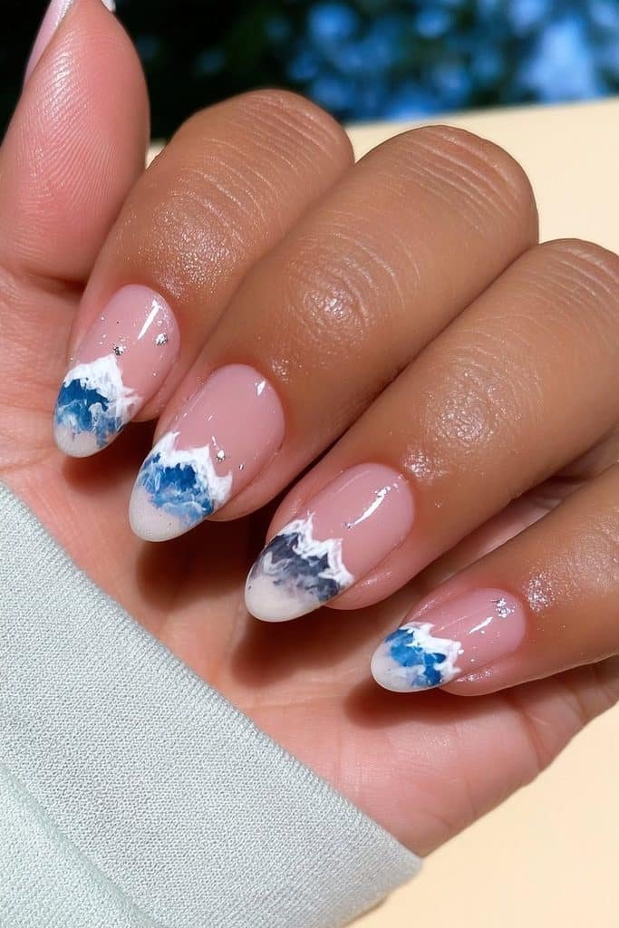 Alpine ski nails featuring icy blue mountain silhouettes with crisp white snowcaps
