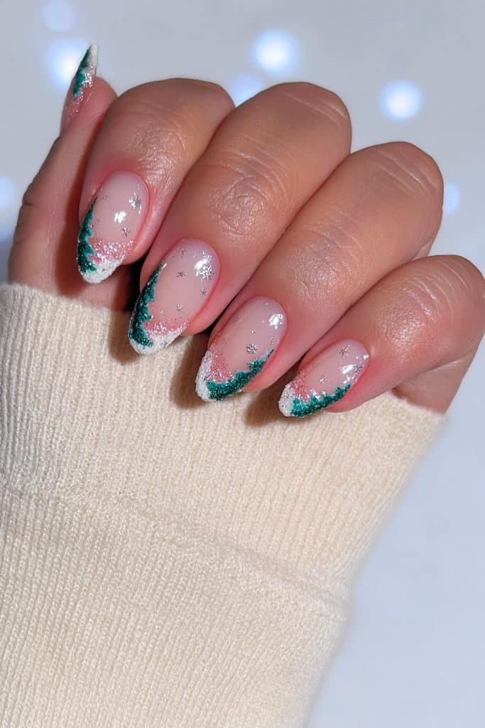 Milky white almond nails with snowy green pine trees and silver snowflakes