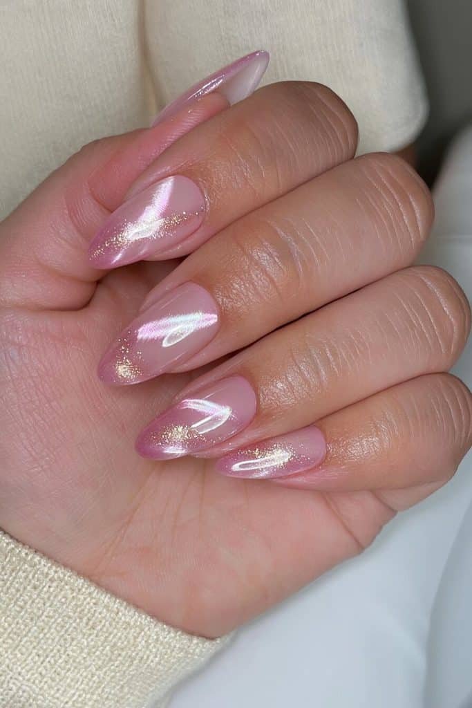 Soft baby pink cat-eye nails with luminous pearly pink bands, milky undertones, and a glossy finish