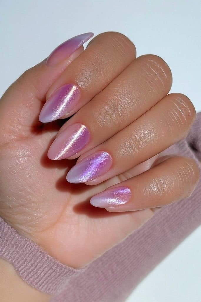 Sugar plum purple chrome almond nails with reflective berry-lavender undertones