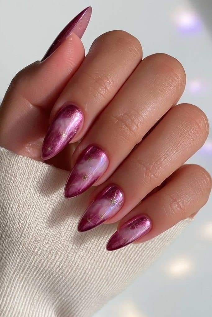 Sugar plum purple chrome almond nails with iridescent lavender reflections and gold stars
