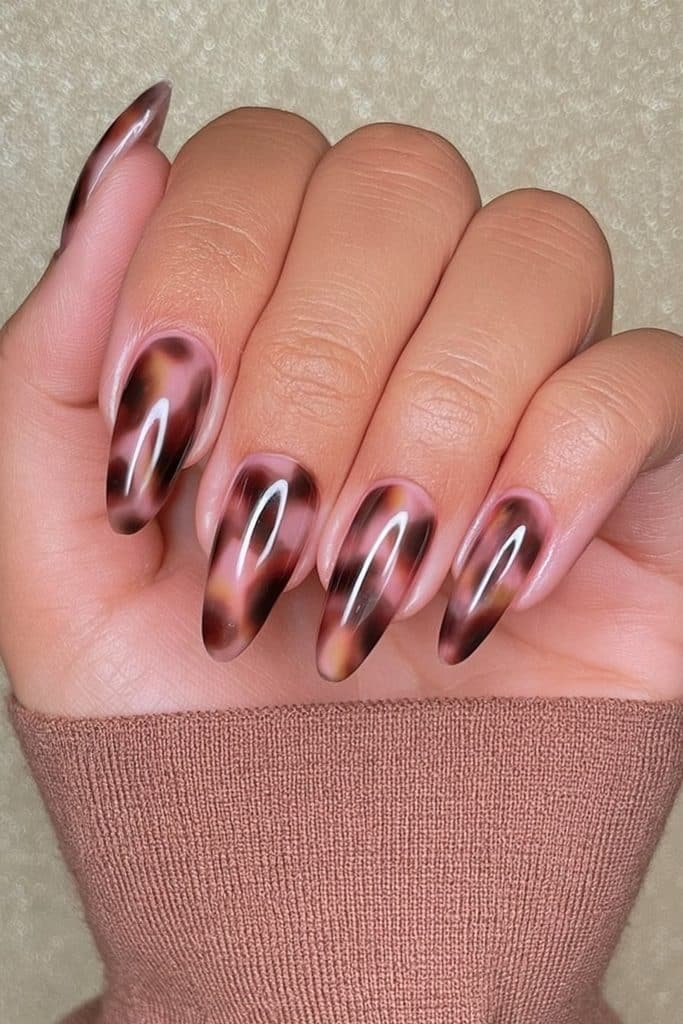 Mocha tortoiseshell nails with translucent espresso, caramel, and honey-brown patches