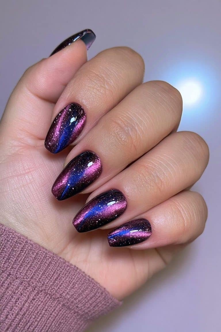 Twilight cat-eye nails blending midnight blue, indigo, and deep violet with luminous cobalt reflections