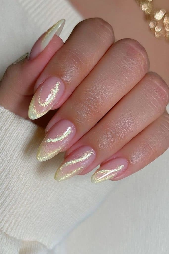 Butter yellow velvet cat-eye nails with luminous pale-gold magnetic reflections