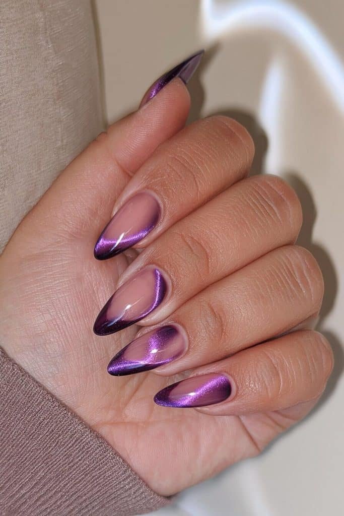 Velvet eggplant cat-eye nails with glowing violet magnetic bands and rich purple shimmer