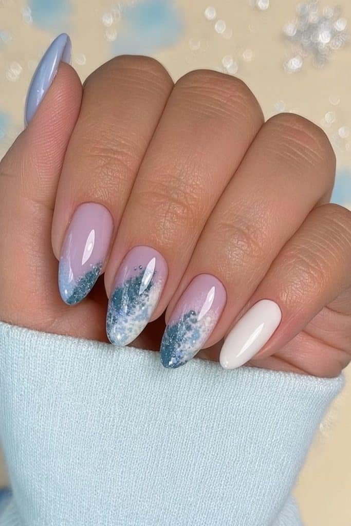 Winter blue skittle nails in powder blue, icy periwinkle, slate blue, and snowy white